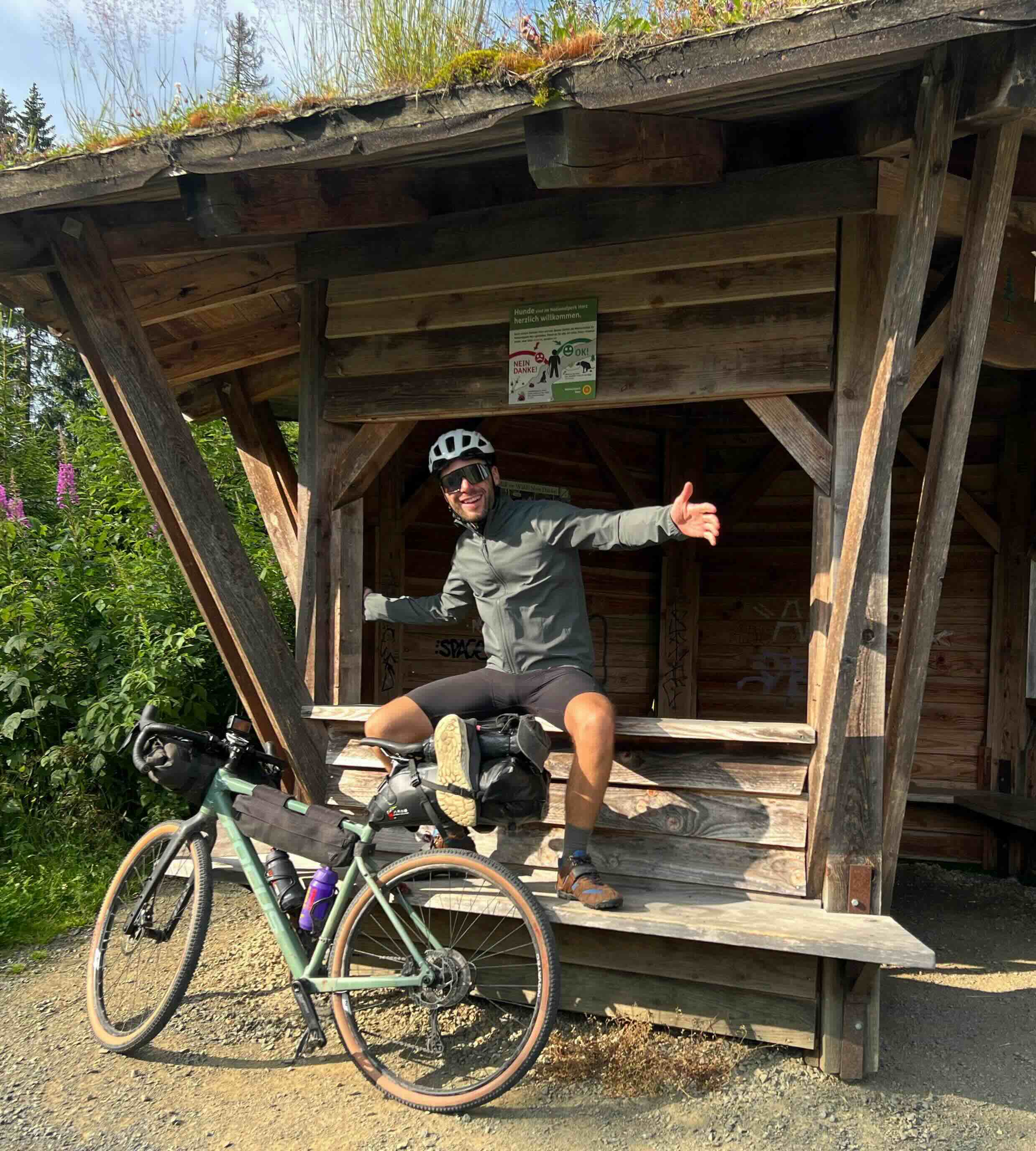 Stan at a shelter with bike